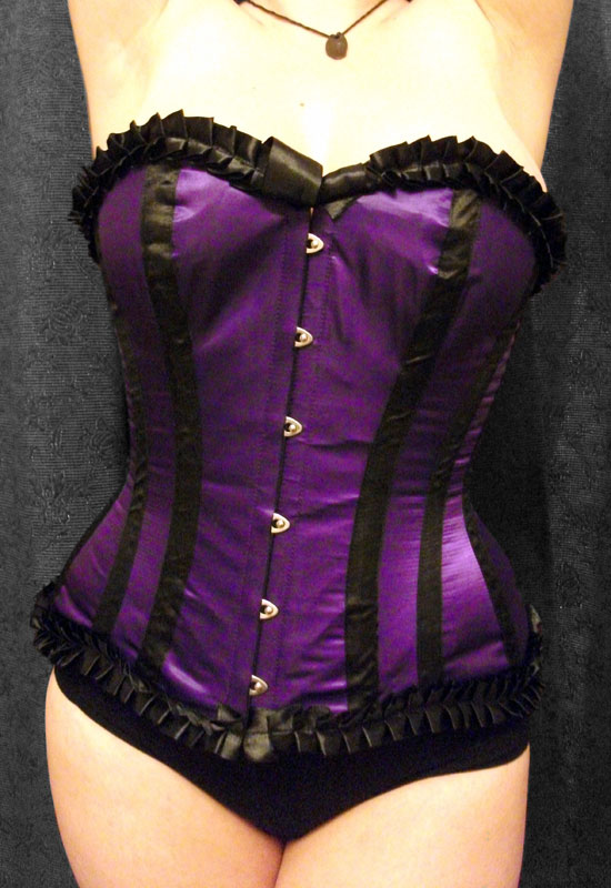 Woman's figure in violet corset